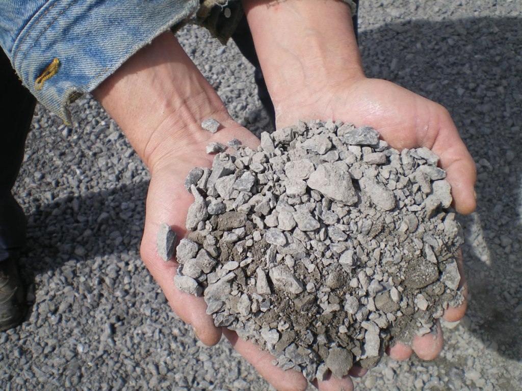 A handful of granular A shown for size.